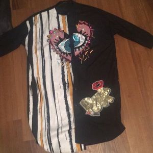 Black Shirt dress with sequence designs on it.